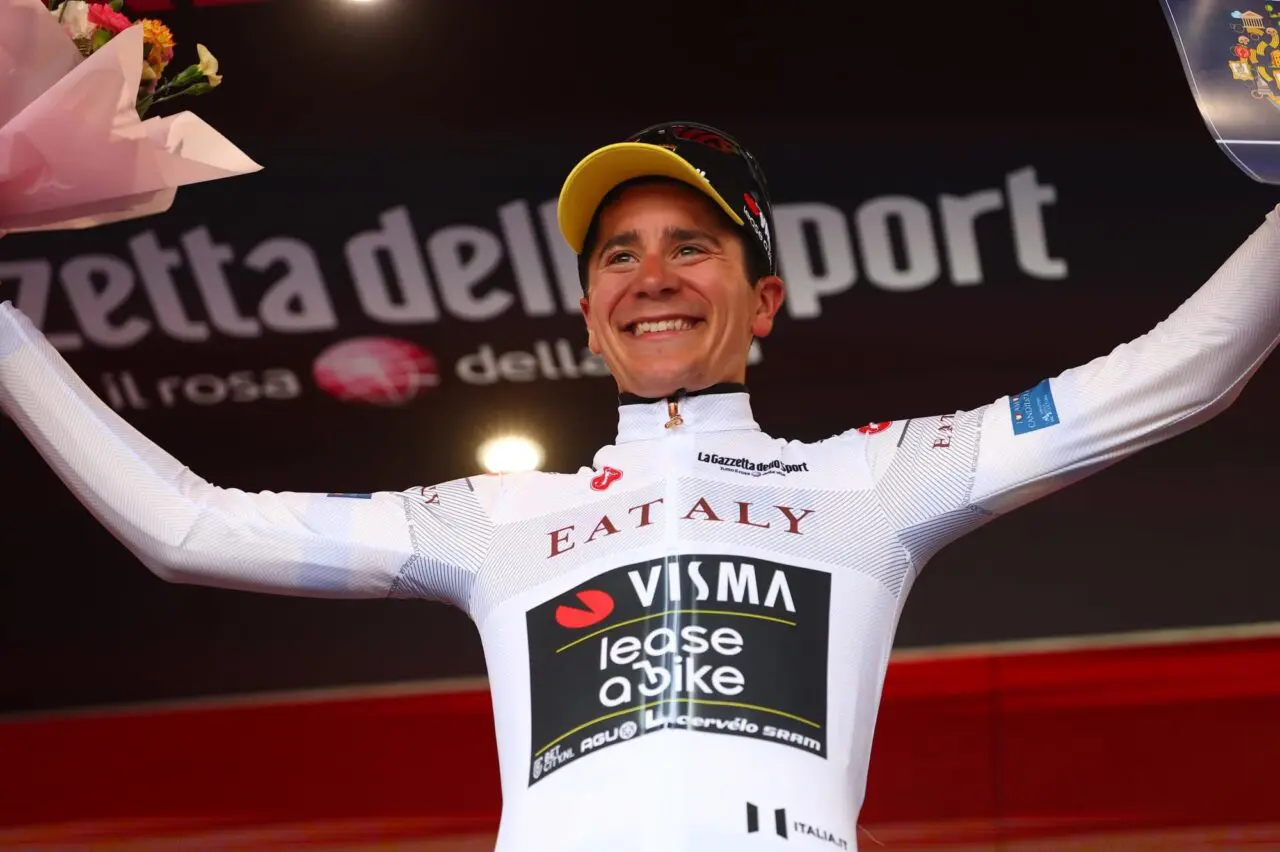 A TvL rider poses on the podium following a Giro win. Be on the front row to hopefully witness similar scenes at the Giro d'Italia 2026
