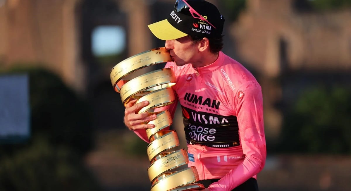 Simon Yates poses with the trophy, having won the Giro d'Italia. Witness scenes like this at the Giro d'Italia 2026
